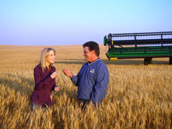 NBC producer Meredith Reis with wheat field farmer Jay Elkin