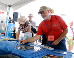 Visitors at the New Holland booth enter to win a $100 Cabela's gift card.